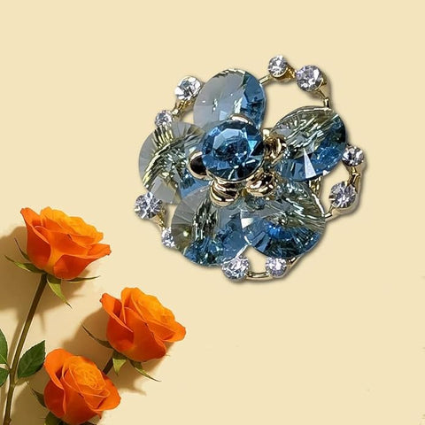 Swarovski Glass Flower Brooch with Blue Crystal Petals & Golden Finish – Elegant Rhinestone Accented Jewelry Pin for Women’s Party, Wedding, Festive & Formal Wear