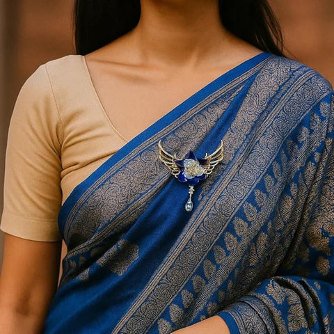 BRIA BY SAAR Blue Crystal Flower Brooch | Elegant Golden Wing Design with Dangling Teardrop Stone | Statement Fine Jewellery for Parties, Weddings & Festive Occasions